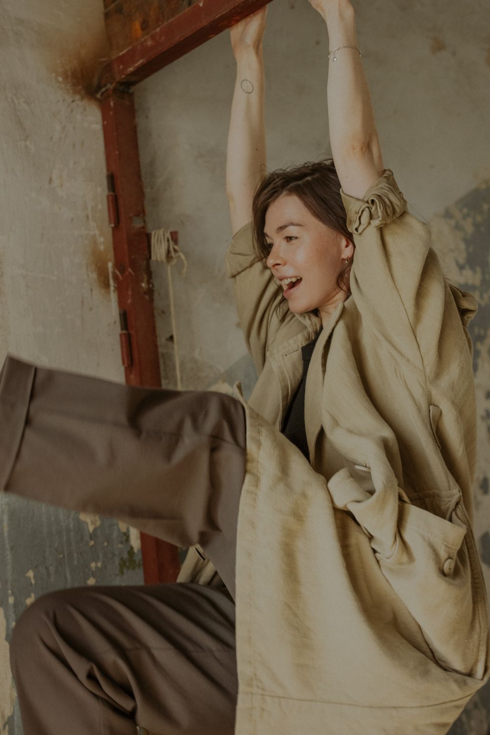 Woman in Brown Coat Sitting on Chair · Free Stock Photo