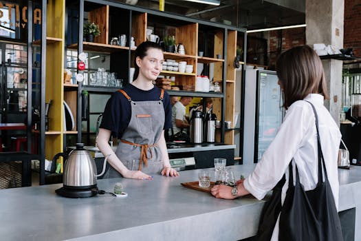 A barista and customer interaction at a contemporary café.