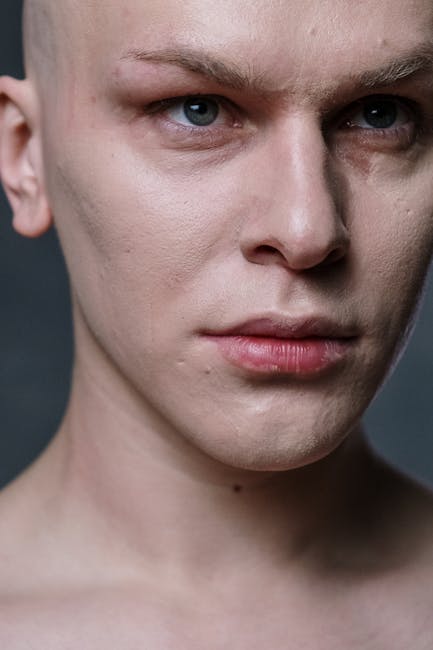 Detailed close-up of a male model showcasing makeup on smooth skin.