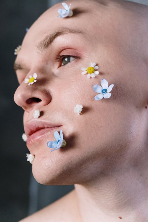 Close up of a woman with white paint all over her body stock photo