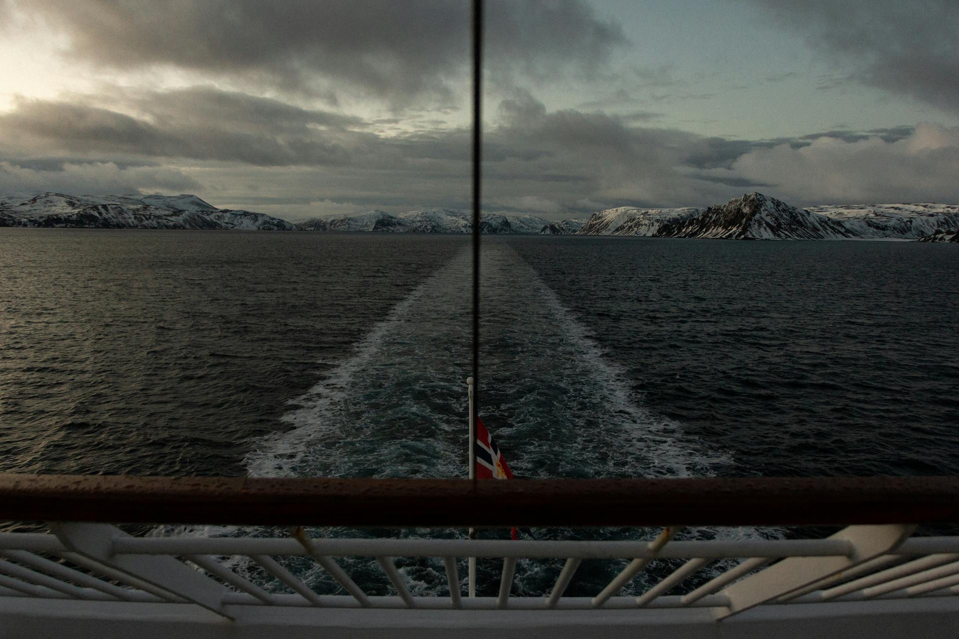Breathtaking seascape from a cruise ship overlooking the snowy Norwegian fjords.