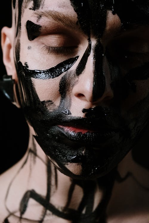 Woman With Black and White Face Paint