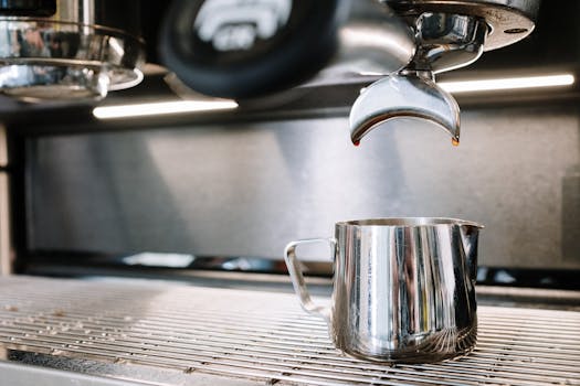 A close-up view of an espresso machine in a professional coffee shop setting.