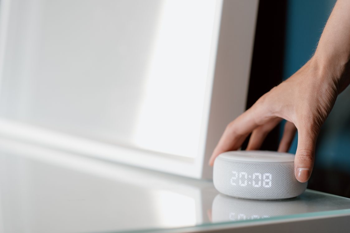 Free A Person Holding White Electronic Device Stock Photo