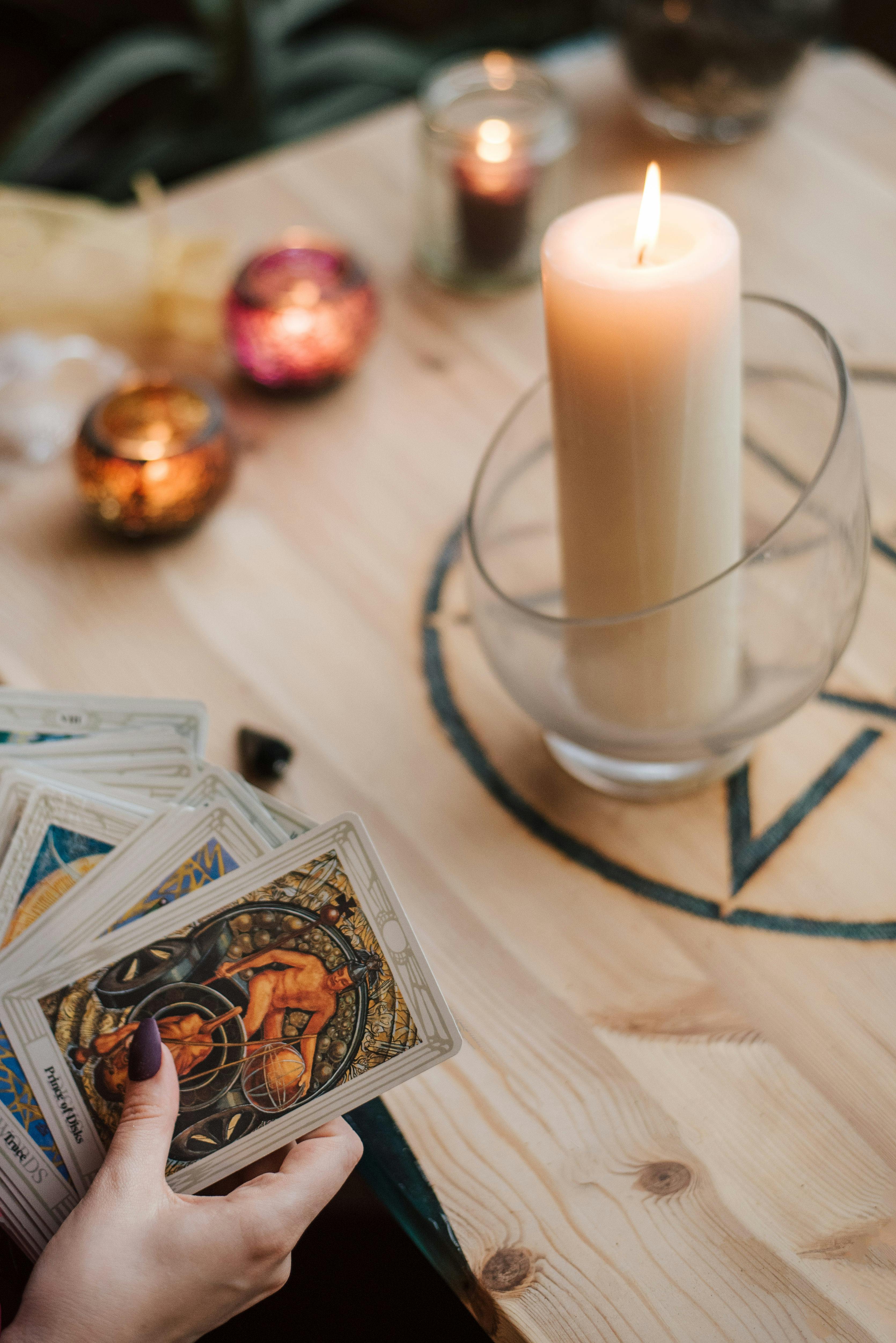 faceless soothsayer predicting fate with tarot cards