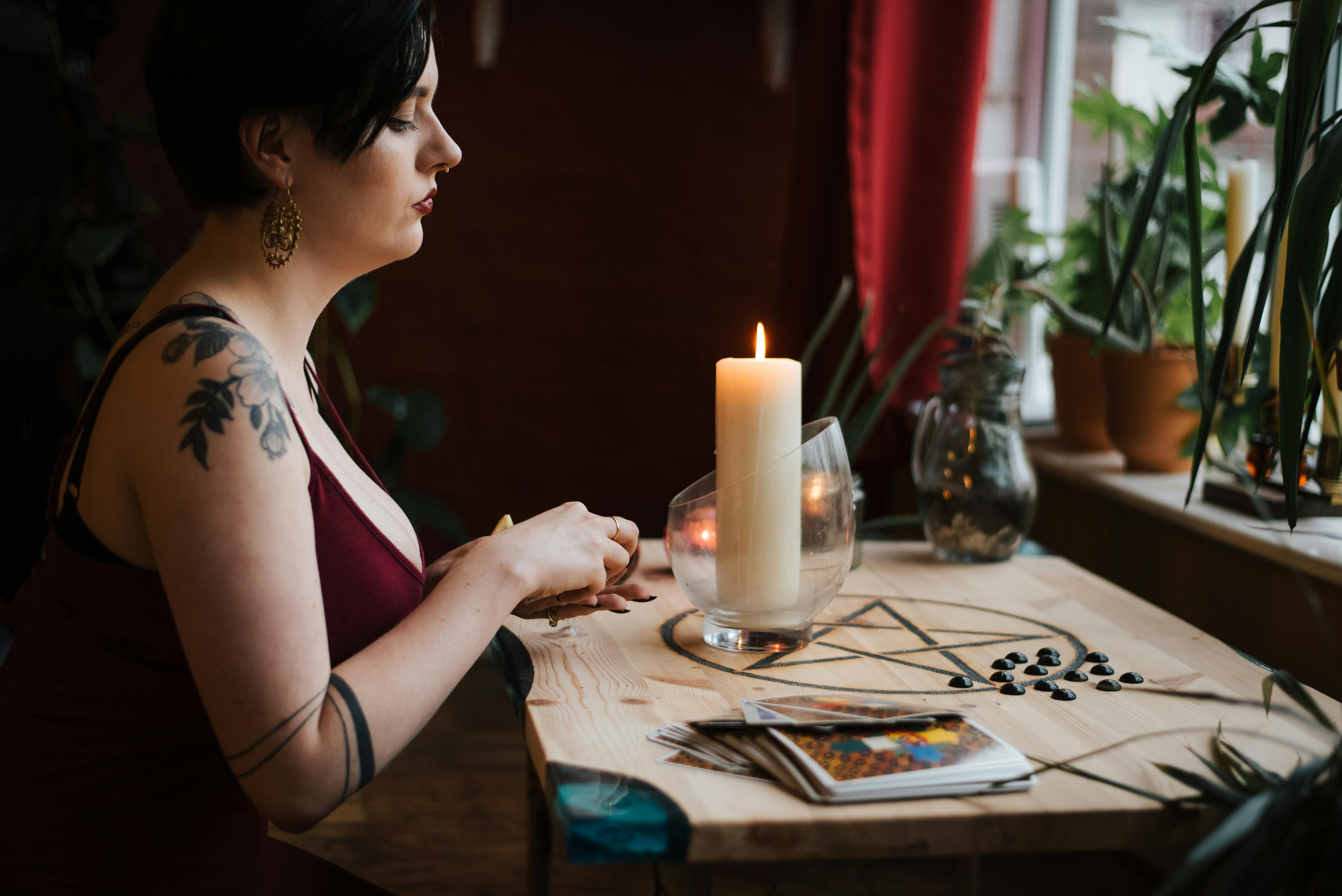 crop fortune teller predicting fate near burning candle