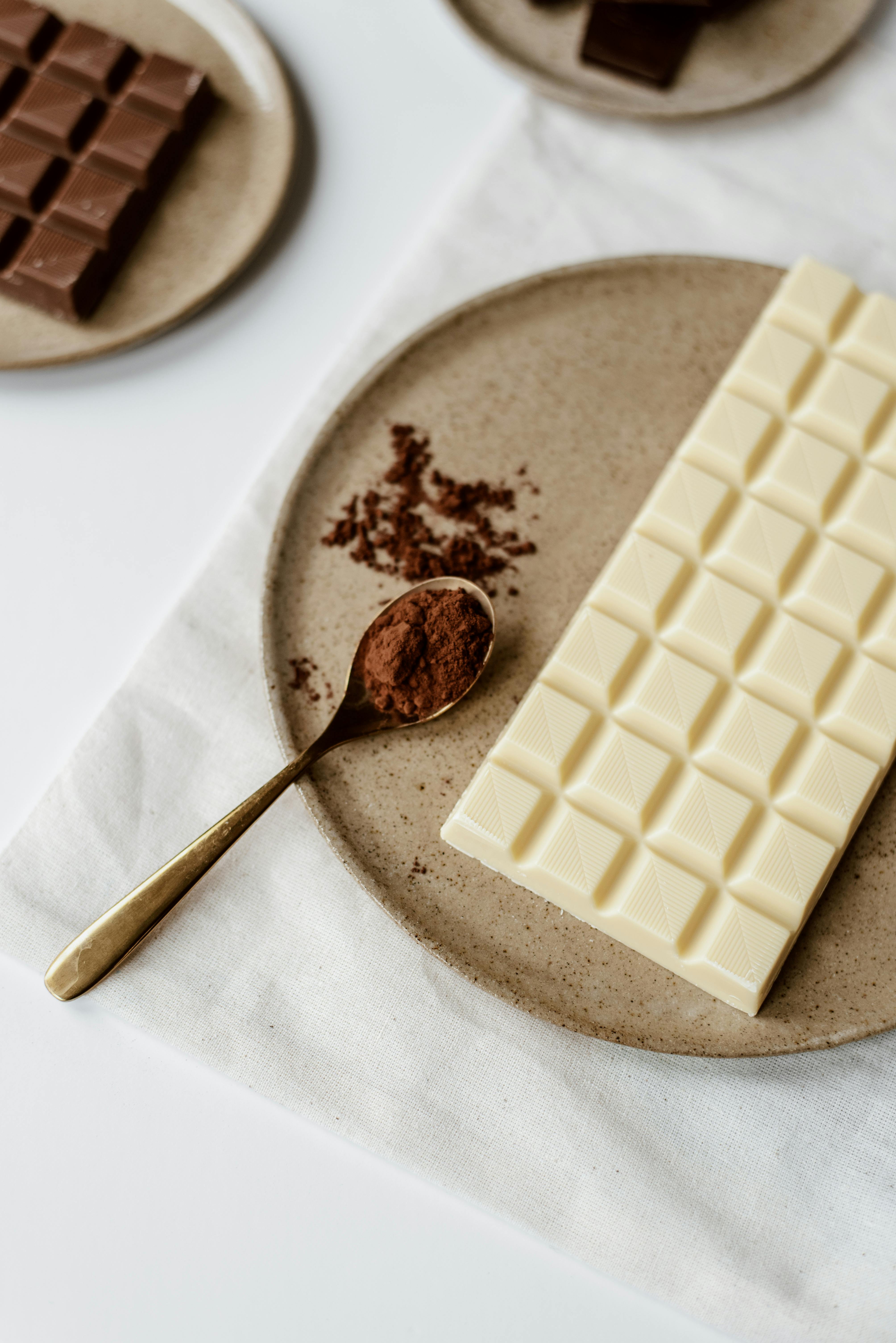 bar with chocolate and cocoa on plate