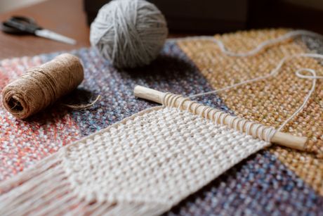 Handwoven cream wall weaving with yarn and twine, by Anete Lusina on Pexels