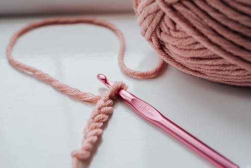 Free Knitted piece and yarn with hook Stock Photo