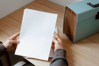 Person showing sheet of paper