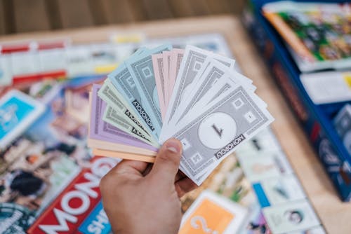 Free Person Holding Fake Monopoly Money  Stock Photo