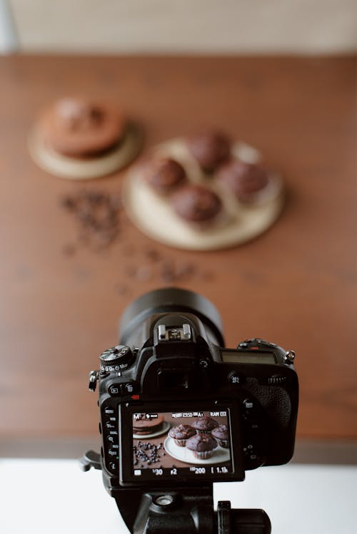 Display of modern photo camera with image of baking products