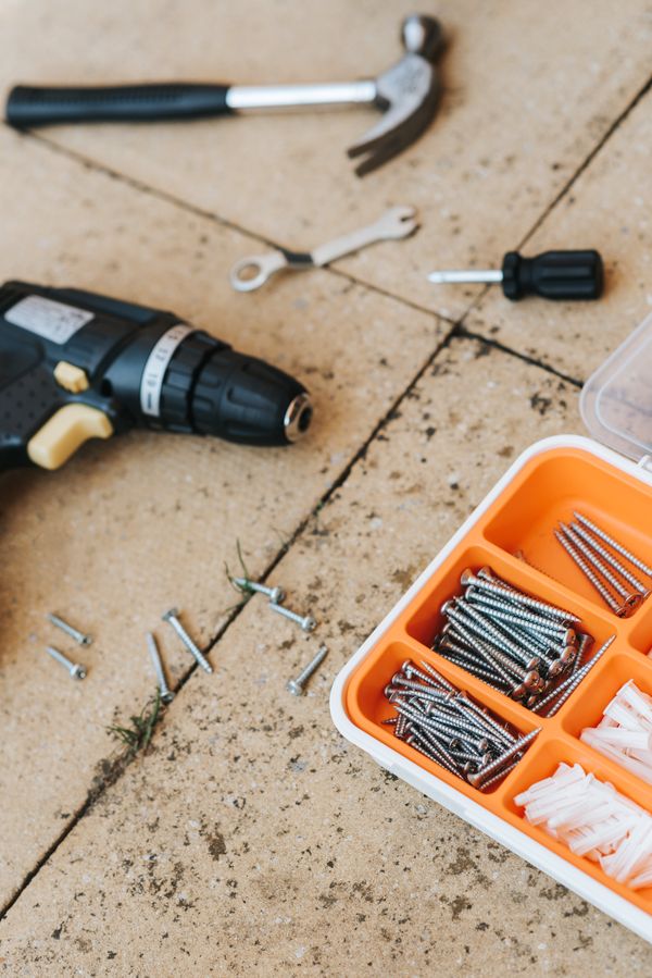 Professional repair tools including wrench and screwdriver for refrigerator servicing