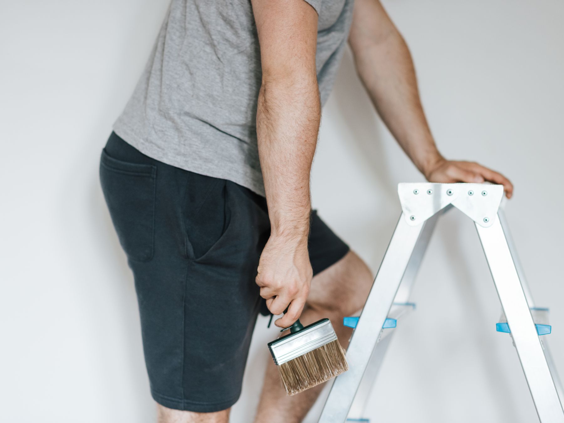 House Painting in Blendon — a decorator at work mid-project