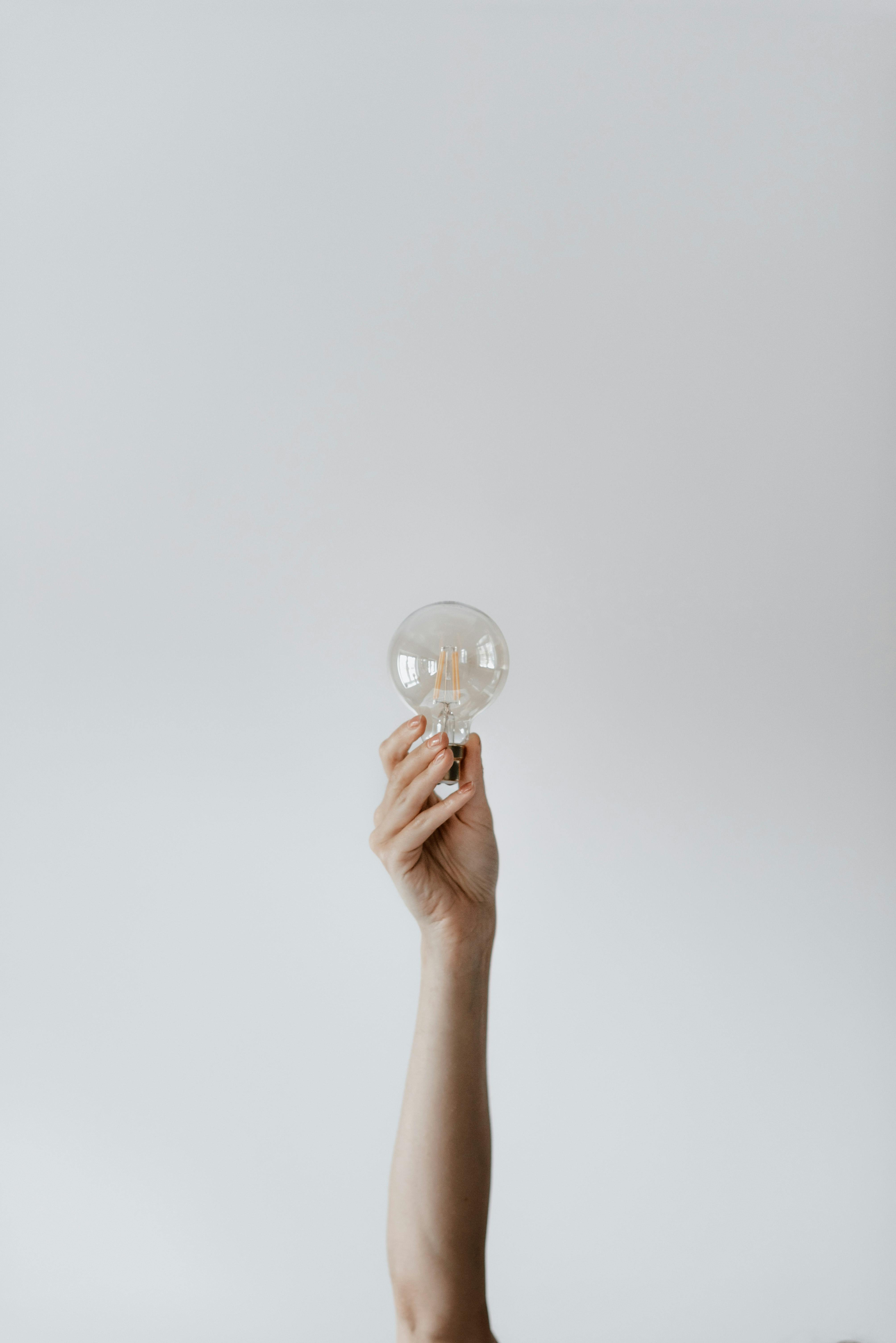 anonymous female showing light bulb