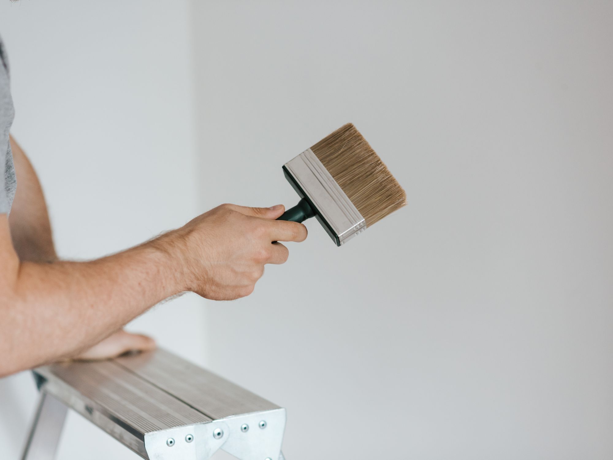 Masonry and Render Painting in Harlington, Hillingdon — professional painter and decorator at work