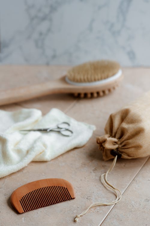 Eco friendly bath brush and comb on table