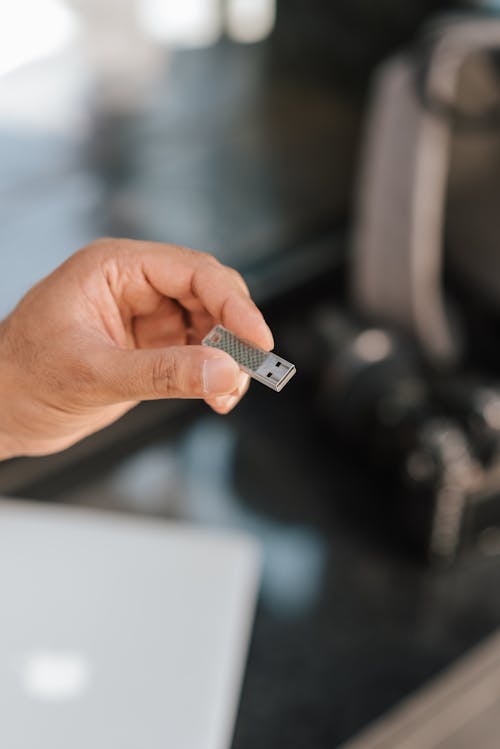 Man using flash drive storing files and information