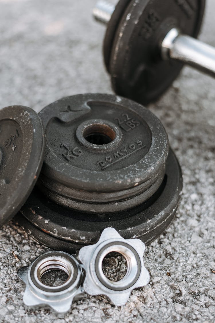 Adjustable Dumbbell With Parts On Ground