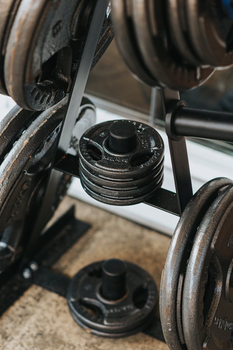 Discs For Barbell On Metal Stand