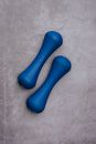 Pair of modern dumbbells on gray background