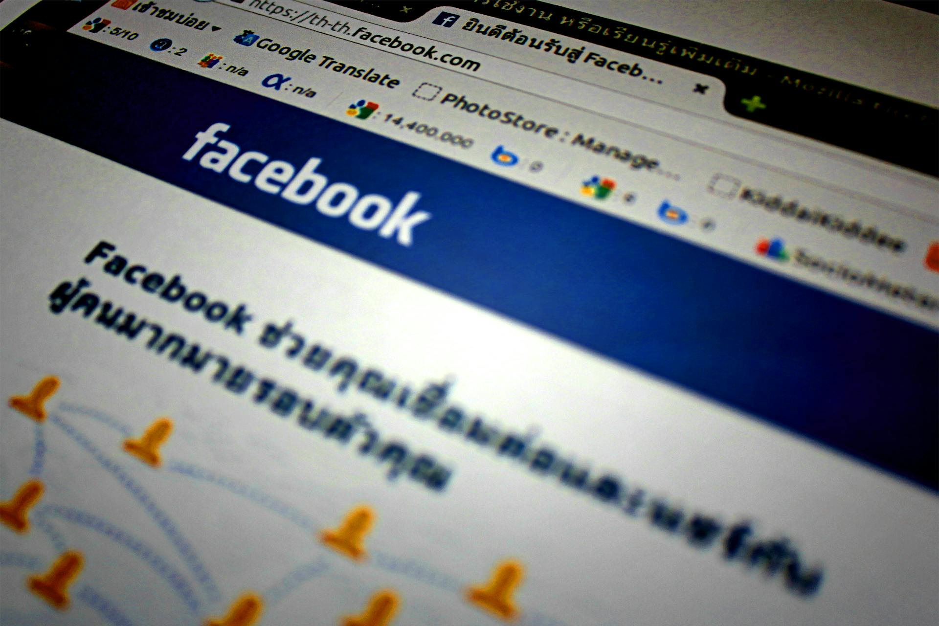 High-angle shot of the Facebook website homepage displayed on a computer screen in Thai language.