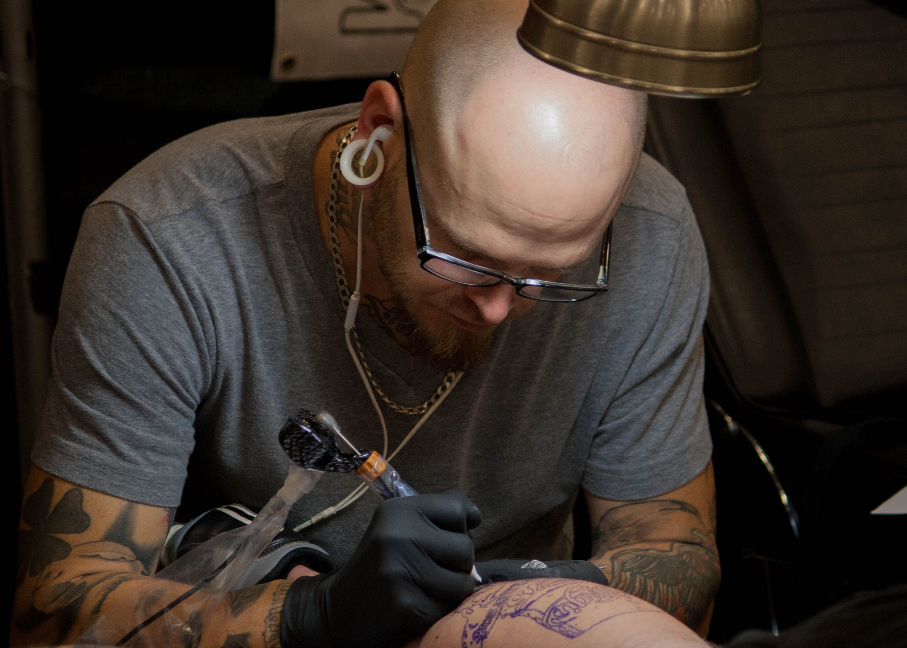 Tattoo Apprentice receiving live in-person mentorship inside an Ink Different Tattoo Studio