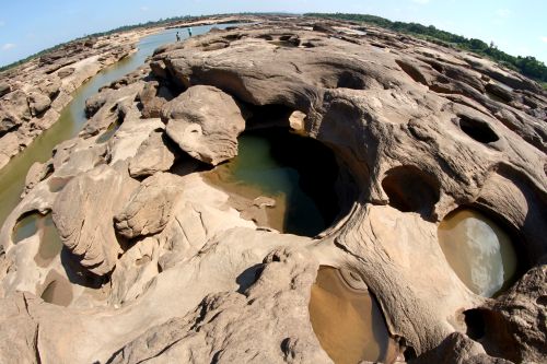 Free Explore the unique rock formations and water holes at the Ubon Ratchathani coastline along the Mekong River in Thailand. Stock Photo