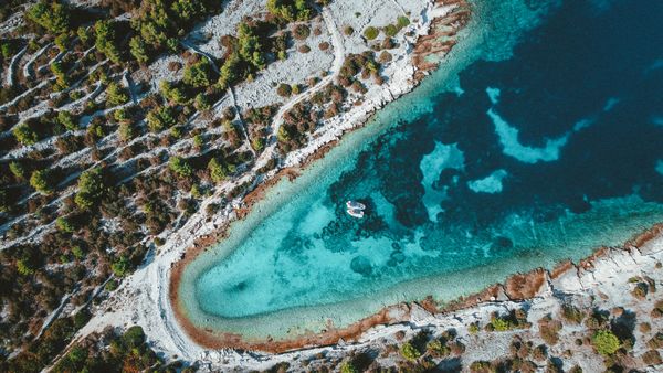 Aerial view of a turquoise Adriatic cove — Julian Brzakala on Pexels