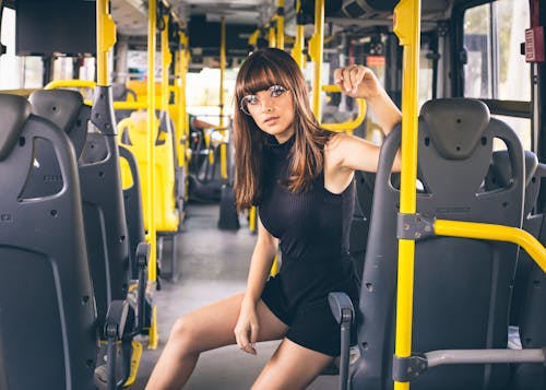 Trendy woman riding modern bus