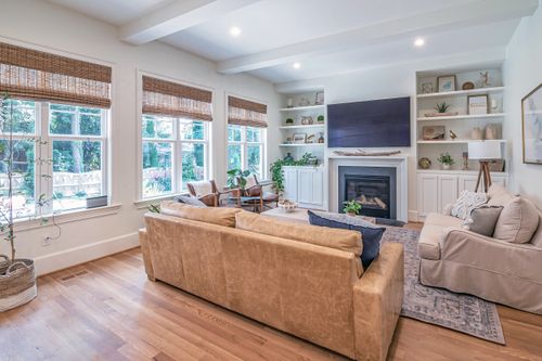 Free A bright and cozy modern living room featuring a fireplace and stylish interior design. Stock Photo