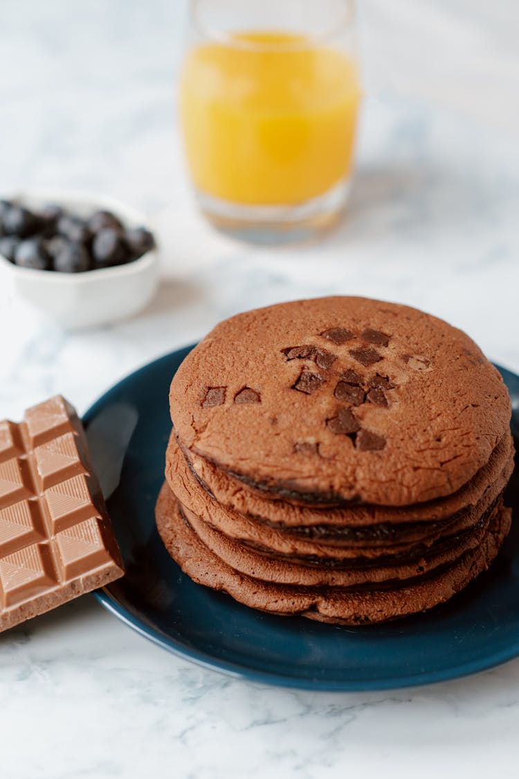 Pile Of Tasty Pancakes Near Milk Chocolate Bar For Breakfast