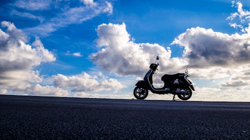 Silhouette Photography of Automatic Motor Scooter