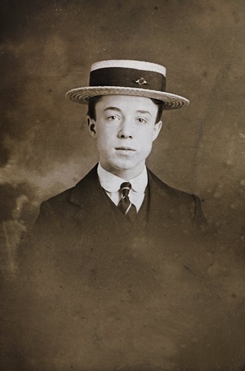 Classic Photo Of Man in Formal Wear With Hat
