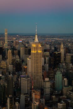 A breathtaking aerial view of New York City's Empire State Building at twilight, capturing cityscape beauty.