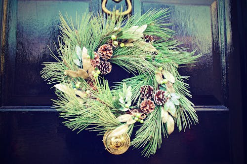 Green and White Wreath on Black Door