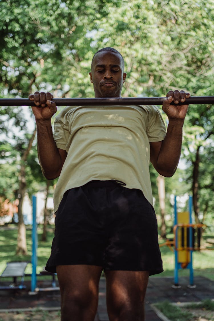 Man Working Out Using A Pull Up Bar