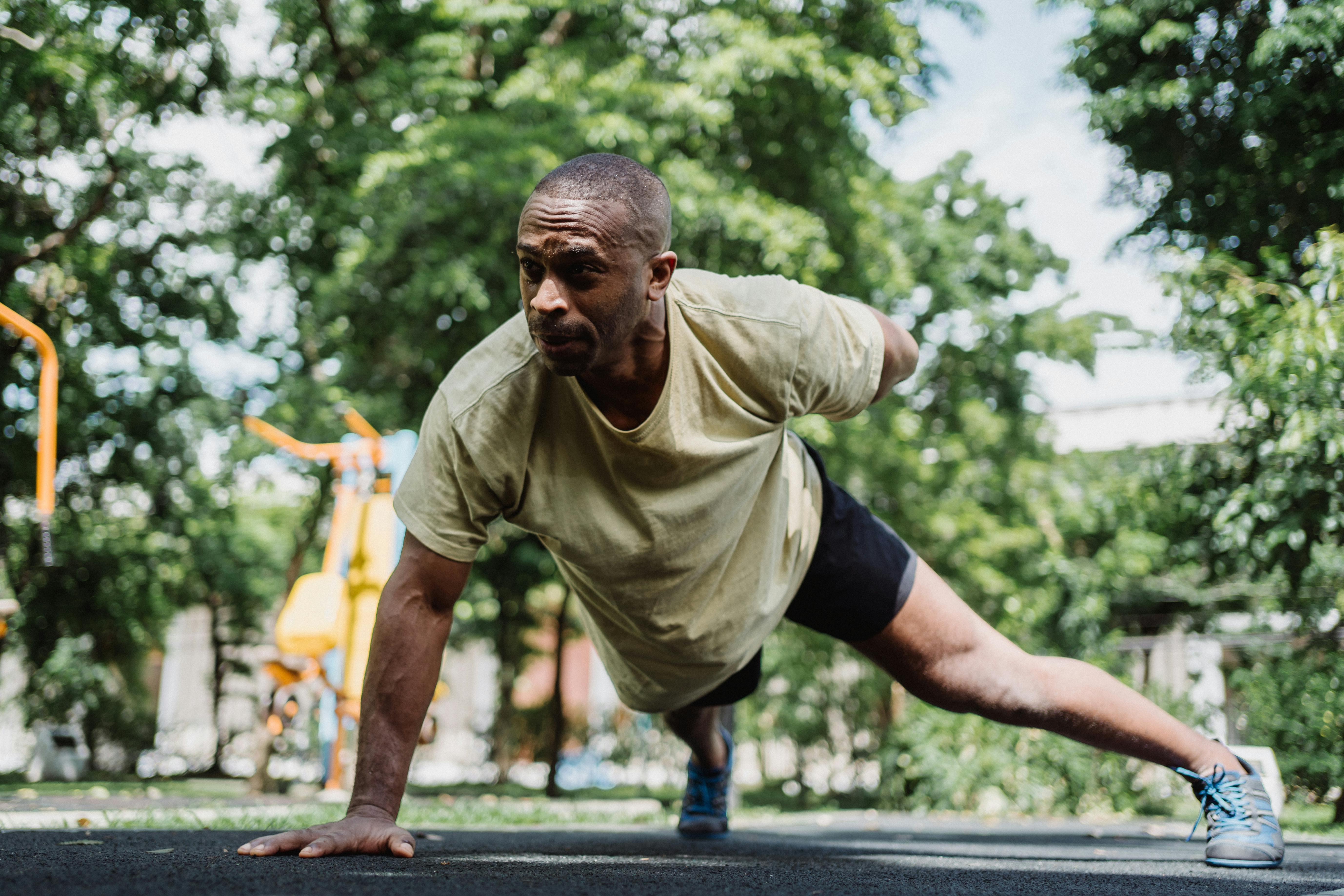 man demonstrating single hand push up