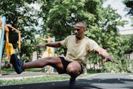 A Man Balancing Himself Using Only His One Leg