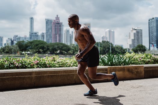 Athletic man running outdoors in urban park for a healthy lifestyle.
