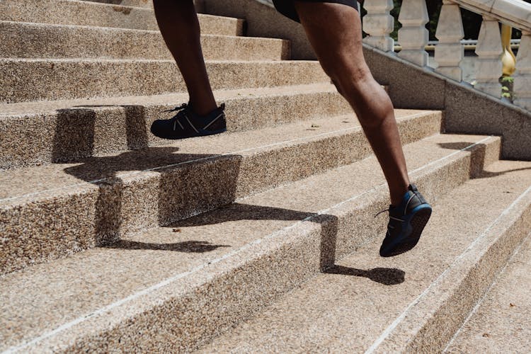 Running Feet On The  Concrete Stairs