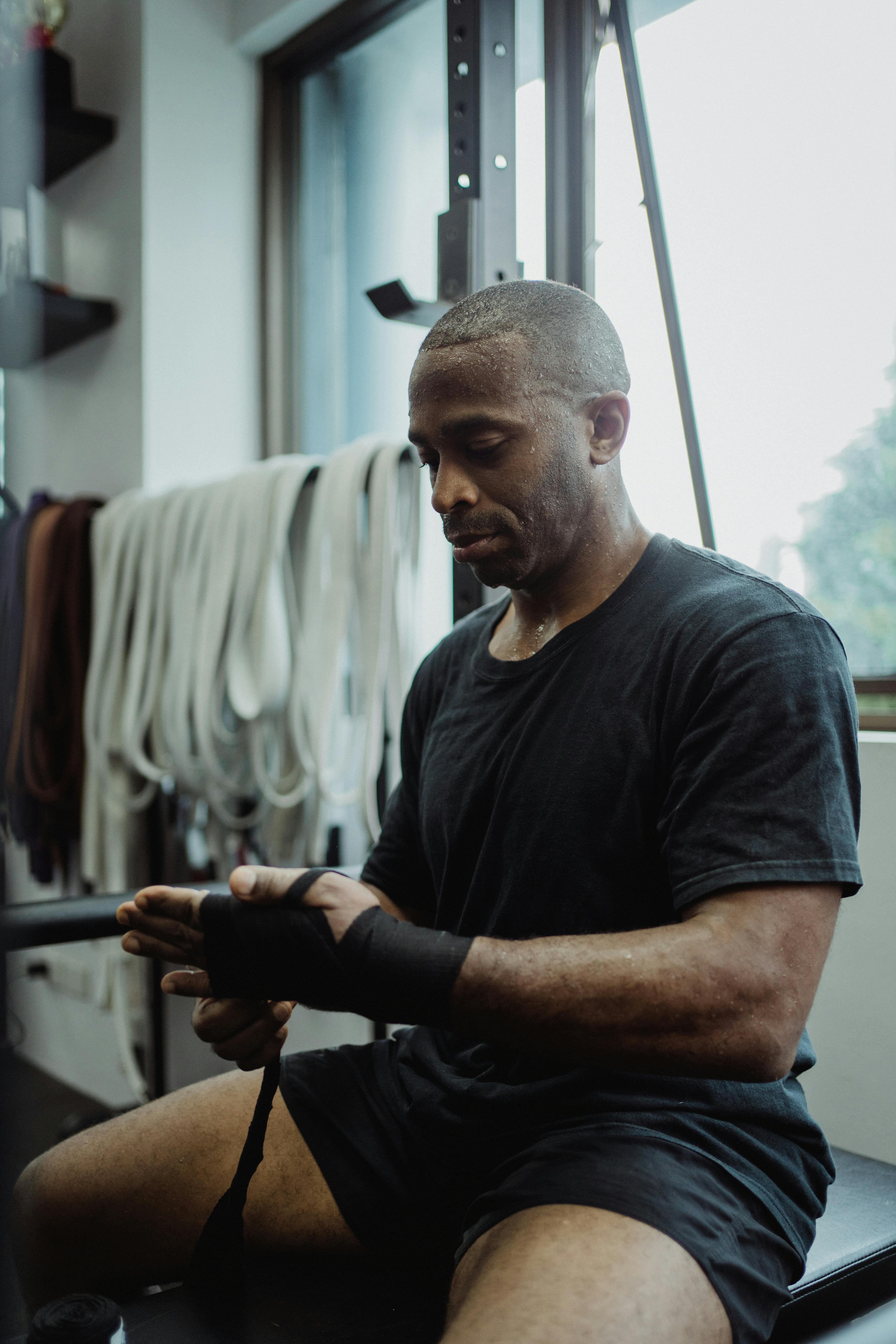 a sweaty man wearing a black shirt