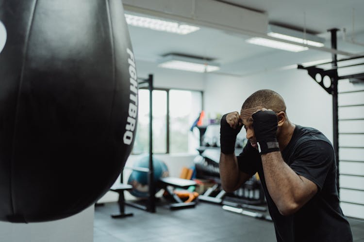 Man In Sports Gym On Boxing Guard Position