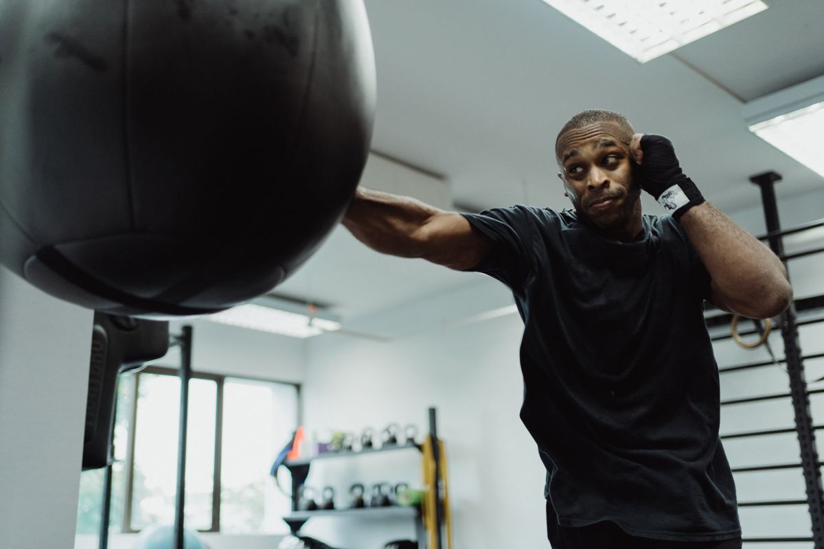 A boxer working a heavy bag