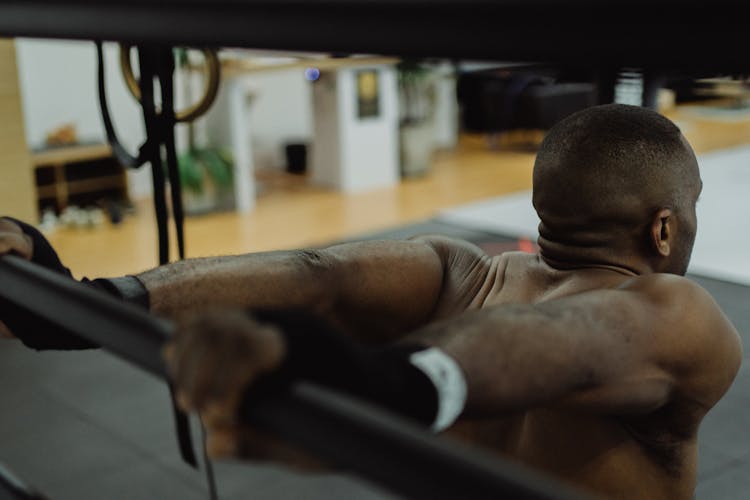 Man Holding On To A Barbell