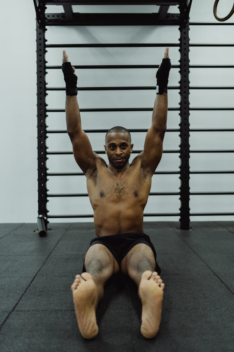 Man Sitting While Stretching His Arms 