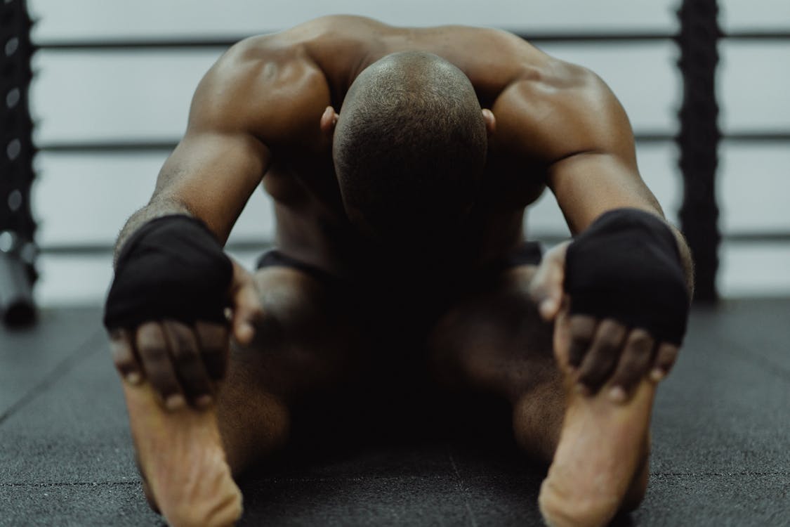 Free  Man Stretching Holding His Feet  Stock Photo