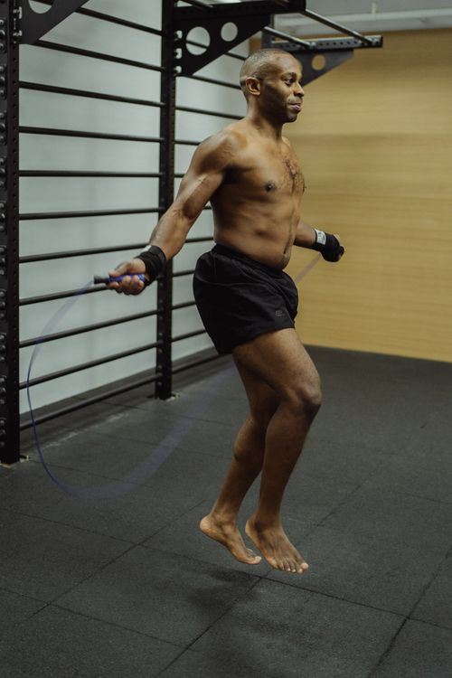 Man Using Jump Rope Model Man Doing a Jump Rope Workout · Free Stock Photo