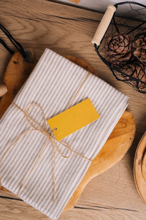 White and Brown Stripe Towel on Brown Wooden Chopping Board