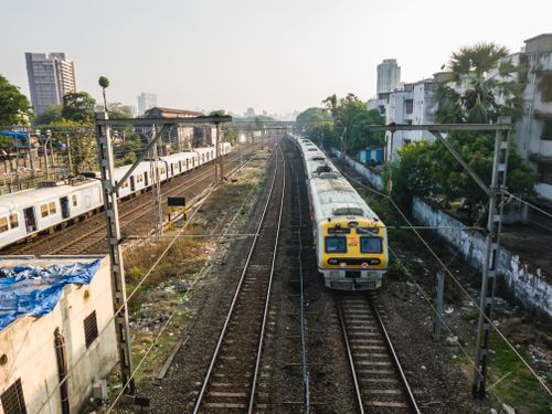 Free Aerial view of trains on tracks at a railway station in Mumbai, India. Stock Photo